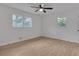 Bedroom with ceiling fan, natural light, and wood-look flooring at 6243 David Sw Ln, Mableton, GA 30126