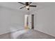 Spacious bedroom with a ceiling fan, neutral carpet, and a closet with louvered doors at 6243 David Sw Ln, Mableton, GA 30126