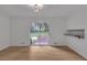 Bright dining room featuring sleek floors, sliding glass doors, and access to the backyard at 6243 David Sw Ln, Mableton, GA 30126