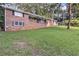 Charming brick home featuring level lawn and traditional windows and shutters at 6243 David Sw Ln, Mableton, GA 30126