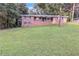 Attractive brick home with well-maintained front lawn and mature trees at 6243 David Sw Ln, Mableton, GA 30126