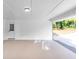 Spacious garage with epoxy flooring, door to backyard, and ample parking space at 6243 David Sw Ln, Mableton, GA 30126
