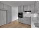 Updated kitchen featuring sleek floors, modern appliances, and gray cabinetry at 6243 David Sw Ln, Mableton, GA 30126