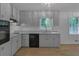 Updated kitchen featuring modern appliances, sleek floors, and an abundance of natural light at 6243 David Sw Ln, Mableton, GA 30126