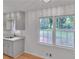 Bright kitchen offers sleek floors, white cabinetry, and an abundance of natural light at 6243 David Sw Ln, Mableton, GA 30126