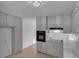 Updated kitchen featuring sleek floors, modern appliances, gray cabinetry, and modern lighting at 6243 David Sw Ln, Mableton, GA 30126
