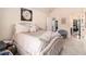 Inviting bedroom with plush bedding, neutral colors, and ample natural light at 817 Nevis Way, Mcdonough, GA 30253