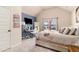 Charming bedroom featuring vaulted ceilings, a cozy desk area, and soft natural light at 817 Nevis Way, Mcdonough, GA 30253