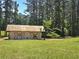 Charming white barn on a sprawling green lot at 2900 Orchard Sw Rd, Conyers, GA 30094