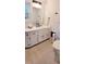Bathroom with white cabinets, black hardware, and a sink with black faucet at 2900 Orchard Sw Rd, Conyers, GA 30094