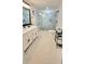 Bathroom with tiled floor, double vanity, and a walk-in shower at 2900 Orchard Sw Rd, Conyers, GA 30094