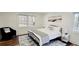 Bedroom with a black frame bed, two side tables, and an accent chair at 2900 Orchard Sw Rd, Conyers, GA 30094