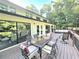 Spacious wooden deck with outdoor furniture perfect for dining and relaxation with view of wooded backyard at 2900 Orchard Sw Rd, Conyers, GA 30094