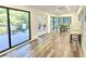 Open dining area offering wood floors, sliding glass doors to the deck, and a sunny disposition at 2900 Orchard Sw Rd, Conyers, GA 30094