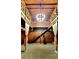 Open great room showcasing wood finishes, a staircase, a modern chandelier, and tall, decorative window treatments at 2900 Orchard Sw Rd, Conyers, GA 30094