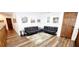 Hallway with two futons, wall art, and interior doors at 2900 Orchard Sw Rd, Conyers, GA 30094