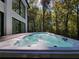 Inviting in-ground hot tub featuring jets, and lush wooded view to enjoy nature's beauty at 2900 Orchard Sw Rd, Conyers, GA 30094