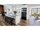 Spacious kitchen with a large center island, stainless steel appliances, and an adjacent dining area at 2900 Orchard Sw Rd, Conyers, GA 30094