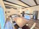 Open-concept living area with an island kitchen, stainless steel appliances, wood flooring, and stylish furnishings at 2900 Orchard Sw Rd, Conyers, GA 30094