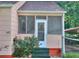 Charming screened front porch with brick accents and a cozy feel at 304 Warren Se St, Atlanta, GA 30317