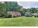 Well-maintained lawn and landscaped yard in front of a cozy home at 304 Warren Se St, Atlanta, GA 30317