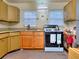 View of the kitchen featuring a stove, cabinets, sink, and two bright, light-filled windows at 304 Warren Se St, Atlanta, GA 30317