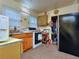 Bright kitchen featuring a stove, sink, refrigerator, and light from two bright windows at 304 Warren Se St, Atlanta, GA 30317