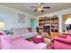 A bright living room with an area rug, two couches, and a wooden bookshelf at 304 Warren Se St, Atlanta, GA 30317