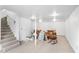 Finished basement with carpeted stairs, recessed lighting, and open layout for flexible use at 3073 Henderson Mill Rd, Atlanta, GA 30341