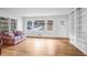 Inviting living room featuring hardwood floors, bright windows, and comfortable seating at 3073 Henderson Mill Rd, Atlanta, GA 30341