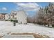 Side view of backyard with lawn and trees in snow at 3870 Golfe Links Dr, Snellville, GA 30039