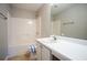A bathroom with a shower/tub combo and single sink vanity at 3870 Golfe Links Dr, Snellville, GA 30039