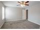 Bedroom with neutral carpet, gray walls, and a ceiling fan at 3870 Golfe Links Dr, Snellville, GA 30039