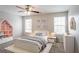 Bright bedroom with a white bed, stylish decor, and ample natural light, perfect for children at 3870 Golfe Links Dr, Snellville, GA 30039