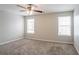 The spacious bedroom is full of natural light from two windows at 3870 Golfe Links Dr, Snellville, GA 30039