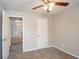 Neutral bedroom with tan carpet, light gray walls and ceiling fan at 3870 Golfe Links Dr, Snellville, GA 30039