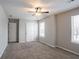 Bedroom with light gray walls, neutral carpet, and ceiling fan at 3870 Golfe Links Dr, Snellville, GA 30039