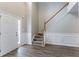 Foyer features a staircase, wood-look flooring, and neutral paint at 3870 Golfe Links Dr, Snellville, GA 30039