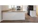 Modern kitchen with granite countertops, white cabinetry, and a black appliances, offering a functional and stylish space at 3870 Golfe Links Dr, Snellville, GA 30039