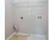Empty laundry room space with connections and utility shelf at 3870 Golfe Links Dr, Snellville, GA 30039