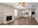 Open floor plan with fireplace, eat-in kitchen, and wood-look floors at 3870 Golfe Links Dr, Snellville, GA 30039