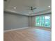 Open bedroom with large windows and a ceiling fan at 4955 Chamblee Dunwoody Rd, Dunwoody, GA 30338