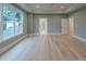 Open bedroom with large windows and a ceiling fan at 4955 Chamblee Dunwoody Rd, Dunwoody, GA 30338