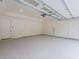 Spacious garage with epoxy flooring, ample lighting, and multiple access doors for convenience at 4955 Chamblee Dunwoody Rd, Dunwoody, GA 30338