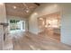 Bright living room features hardwood floors, fireplace, and sliding glass doors to outdoor space at 4955 Chamblee Dunwoody Rd, Dunwoody, GA 30338