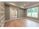 Office space with custom built-in shelving and glass french doors at 4955 Chamblee Dunwoody Rd, Dunwoody, GA 30338
