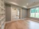 Office space with beautiful floors and a built-in bookshelf at 4955 Chamblee Dunwoody Rd, Dunwoody, GA 30338