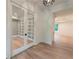 Bright office space with custom built-in bookshelves and light hardwood floors, perfect for working at home at 4955 Chamblee Dunwoody Rd, Dunwoody, GA 30338