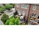 A townhouse backyard view features a comfortable deck with stylish furniture and lots of room for relaxing at 565 Rose Garden Ln, Alpharetta, GA 30009