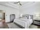 Relaxing bedroom with a tray ceiling, soft carpet, and plenty of natural light from the window at 565 Rose Garden Ln, Alpharetta, GA 30009